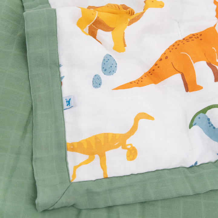 Wrap your toddler in warmth with Little Unicorn Cotton Muslin Toddler Comforter - Dino Names, ideal for snuggles.