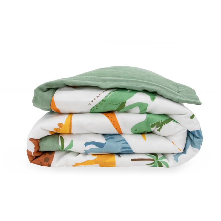 Soft and cuddly, the Little Unicorn Cotton Muslin Toddler Comforter - Dino Names makes a perfect baby comforter.