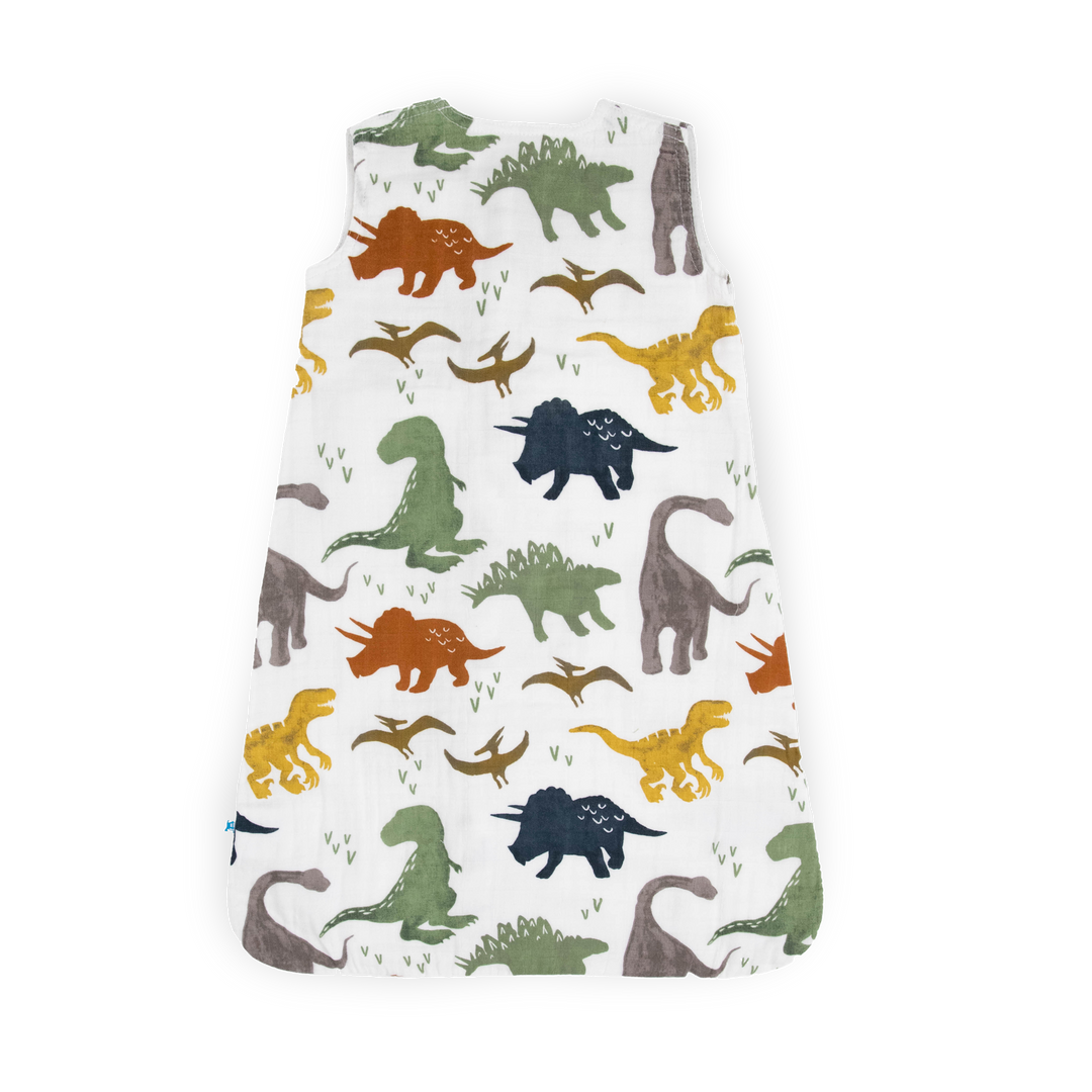 Wrap your little one in comfort with Little Unicorn Cotton Muslin Sleep Bag - Dino Friends, a gentle baby sleep bag.