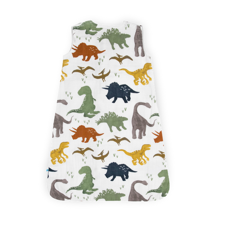 Wrap your little one in comfort with Little Unicorn Cotton Muslin Sleep Bag - Dino Friends, a gentle baby sleep bag.