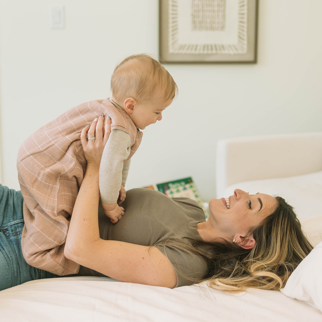 Styled crib with Little Unicorn Cotton Muslin Sleep Bag - Mauve Stripe, comfortable sleeping bag baby for toddlers.