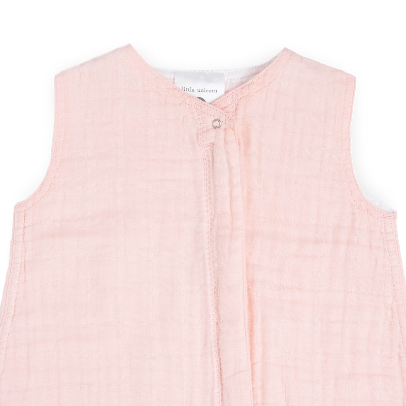 Close-up of Little Unicorn Cotton Muslin Toddler Comforter - Light Pink, gentle baby sleeping bag for cozy naps.