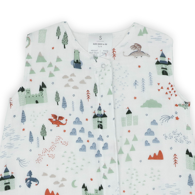 Close-up of Little Unicorn Cotton Muslin Toddler Comforter - Dragon Days, cozy baby sleeping bag with playful dragon design.