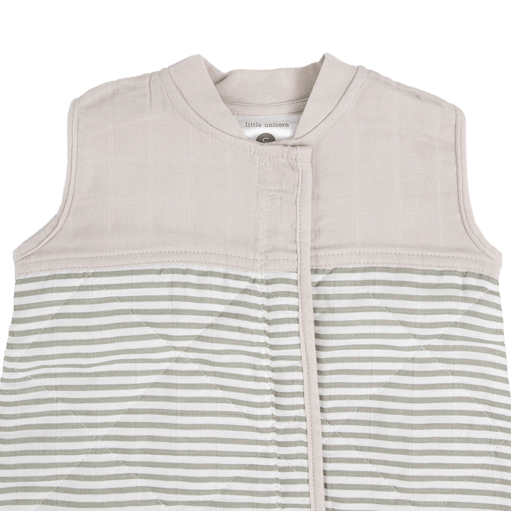 Close-up of Little Unicorn Cotton Muslin Quilted Sleep Bag - Grey Stripe, breathable fabric ideal as a baby sleeping bag.