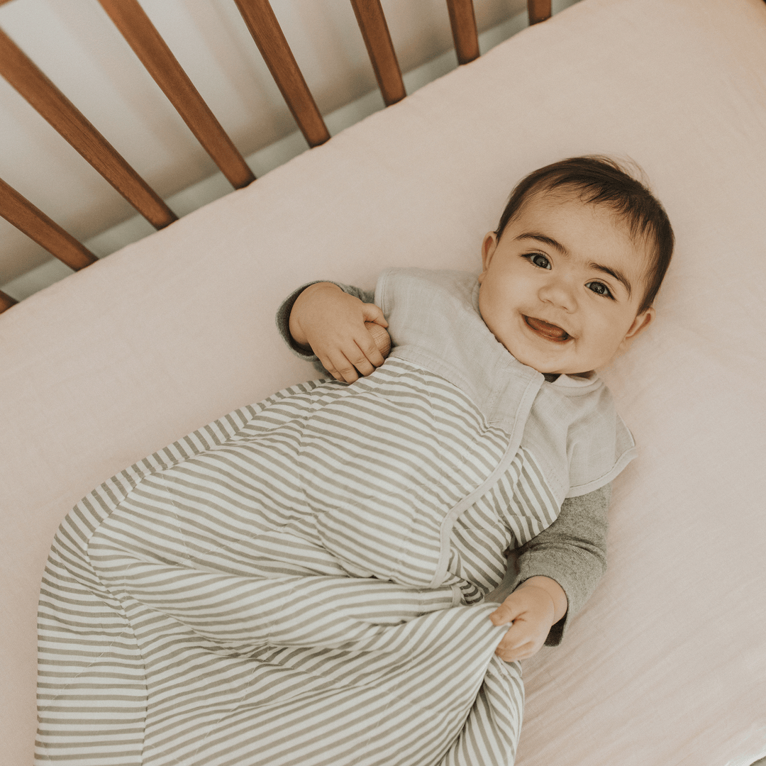 Detail of Little Unicorn Cotton Muslin Quilted Sleep Bag - Grey Stripe, quilted muslin fabric for a soft sleep bag baby.