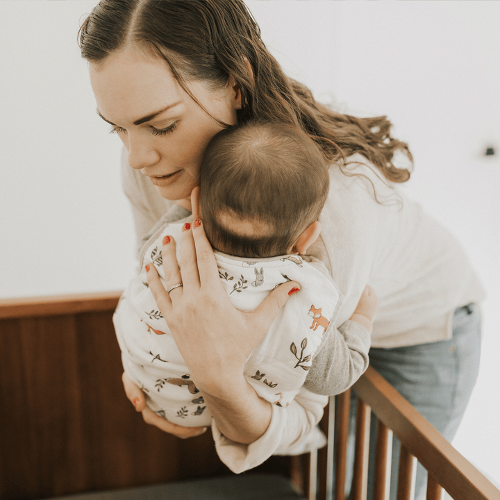 Styled crib featuring Little Unicorn Cotton Muslin Quilted Sleep Bag - Forest Friends, comfortable sleeping bag baby for toddlers.