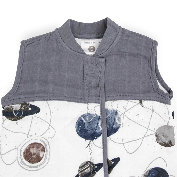 Close-up of Little Unicorn Cotton Muslin Quilted Sleep Bag - Planetary highlighting soft quilted fabric for a baby sleeping bag.