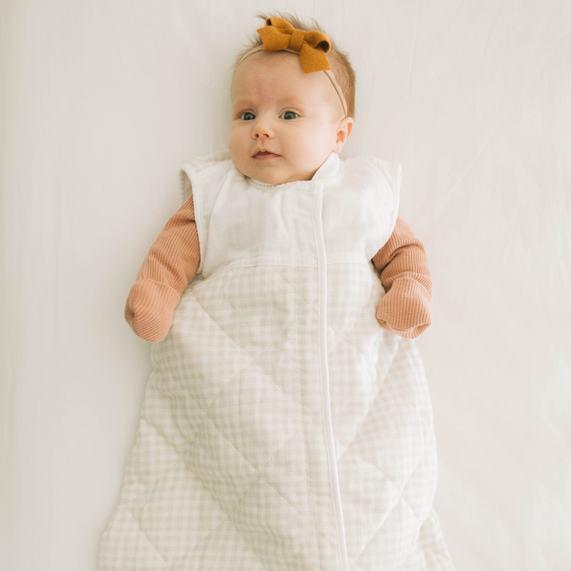 Little Unicorn Cotton Muslin Quilted Sleep Bag - Tan Gingham displayed open, safe and snug sleep bags for babies.