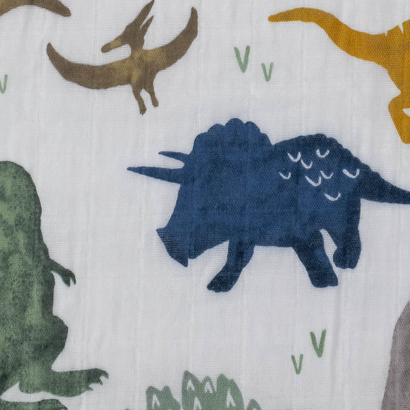 Add prehistoric charm with the Little Unicorn Cotton Muslin Crib Sheet - Dino Friends, perfect fitted crib sheets for baby boys.