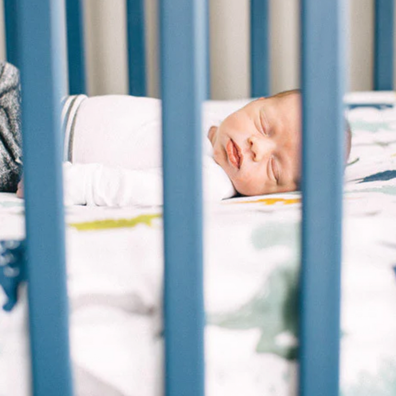 Little Unicorn Cotton Muslin Crib Sheet - Dino Friends features adorable dino prints, the best crib sheets for modern nurseries.