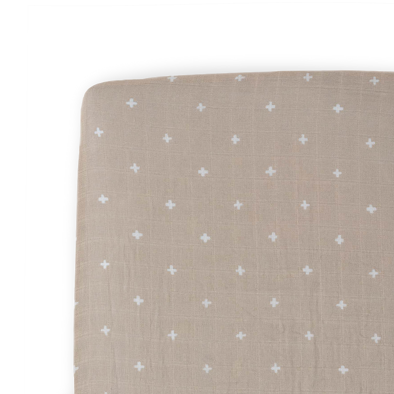 Little Unicorn Cotton Muslin Crib Sheet - Taupe Cross neatly folded, soft muslin fabric makes ideal baby crib sheets.