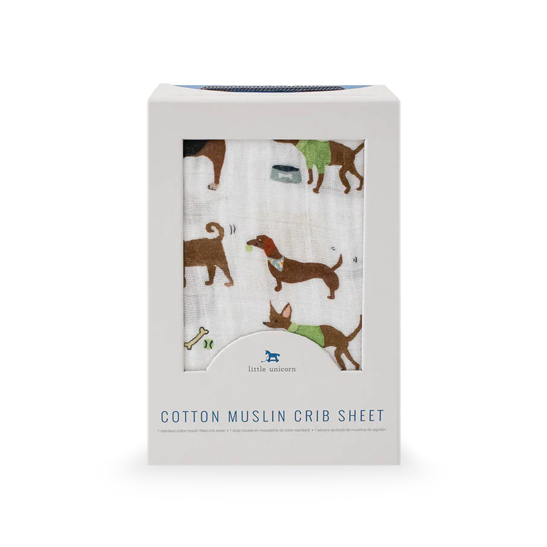 Playful design on Little Unicorn Cotton Muslin Crib Sheet - Woof featuring dog illustrations, perfect cotton sheet for crib.