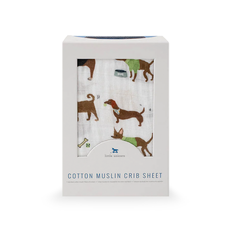 Playful design on Little Unicorn Cotton Muslin Crib Sheet - Woof featuring dog illustrations, perfect cotton sheet for crib.