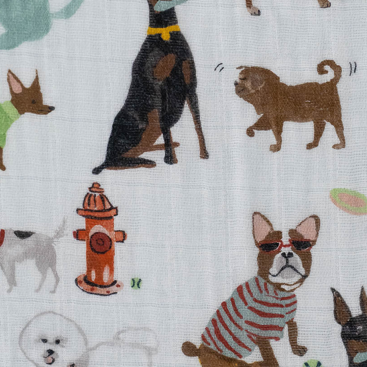 Little Unicorn Cotton Muslin Crib Sheet - Woof styled on mattress, best crib sheets for cozy and stylish baby bedding.