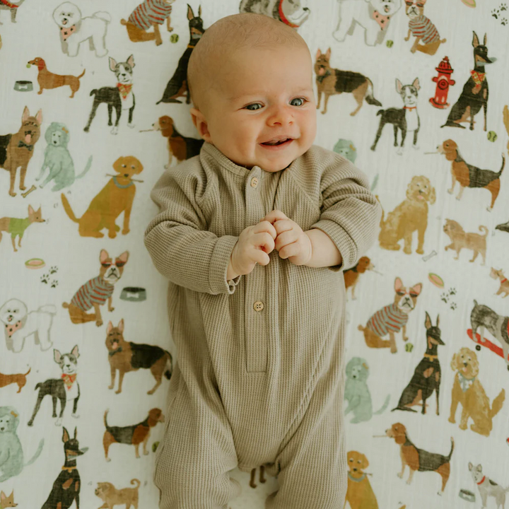 Little Unicorn Cotton Muslin Crib Sheet - Woof shown fitted on mattress, lightweight and gentle fitted crib sheets.