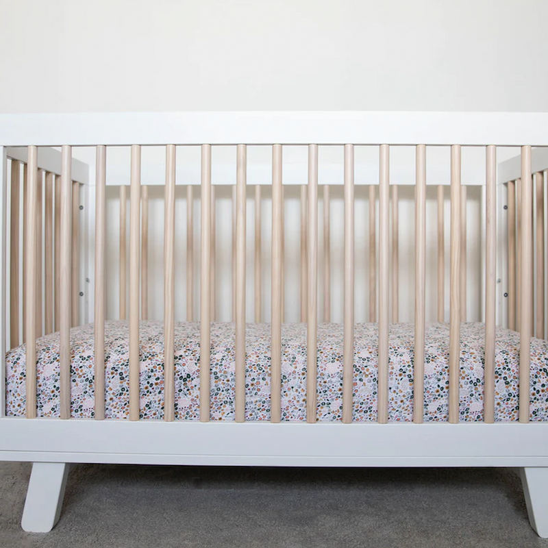 Little Unicorn Cotton Muslin Crib Sheet - Pressed Petals flat lay highlighting texture, cozy and stylish crib mattress sheets.