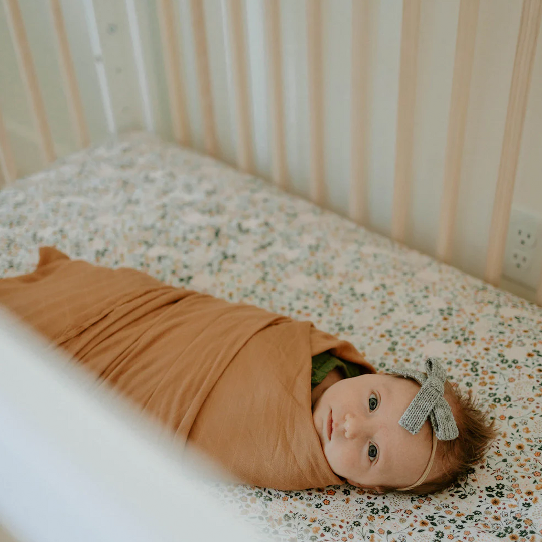 Soft and charming Little Unicorn Cotton Muslin Crib Sheet - Pressed Petals, ideal organic cotton crib sheets for everyday use.