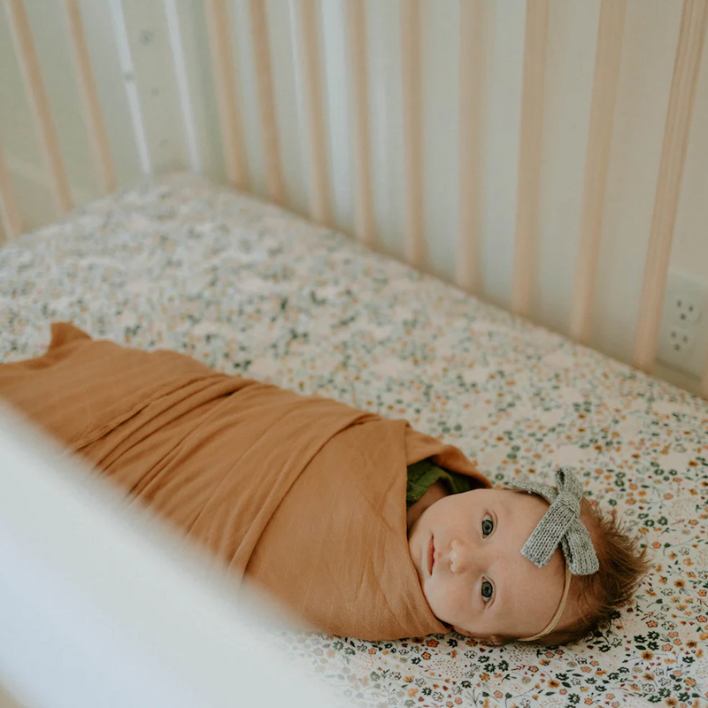 Soft and charming Little Unicorn Cotton Muslin Crib Sheet - Pressed Petals, ideal organic cotton crib sheets for everyday use.