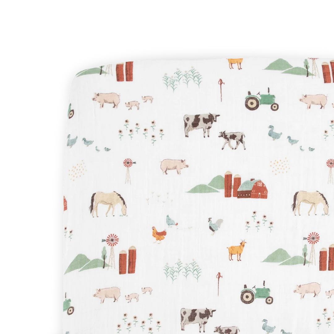 Little Unicorn Cotton Muslin Crib Sheet - Farmyard featuring charming barnyard animals, crafted from breathable muslin crib sheets.