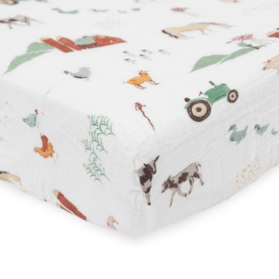 Adorable farm-inspired Little Unicorn Cotton Muslin Crib Sheet - Farmyard, the perfect organic crib sheet for baby’s room.