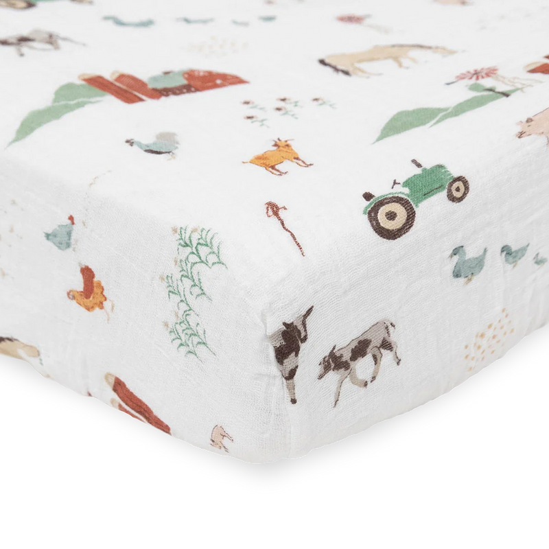 Adorable farm-inspired Little Unicorn Cotton Muslin Crib Sheet - Farmyard, the perfect organic crib sheet for baby’s room.