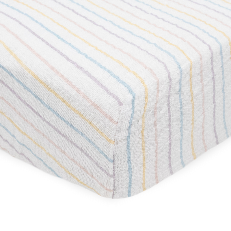 Pastel stripe design on Little Unicorn Cotton Muslin Crib Sheet - Unicorn Stripe, perfect addition to any crib sheet set.