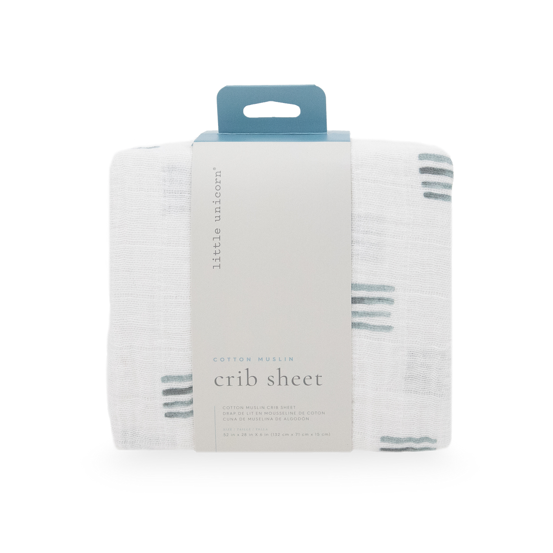 Little Unicorn Blue Stacks Cotton Muslin Crib Sheet styled on crib, one of the best crib sheets for newborns