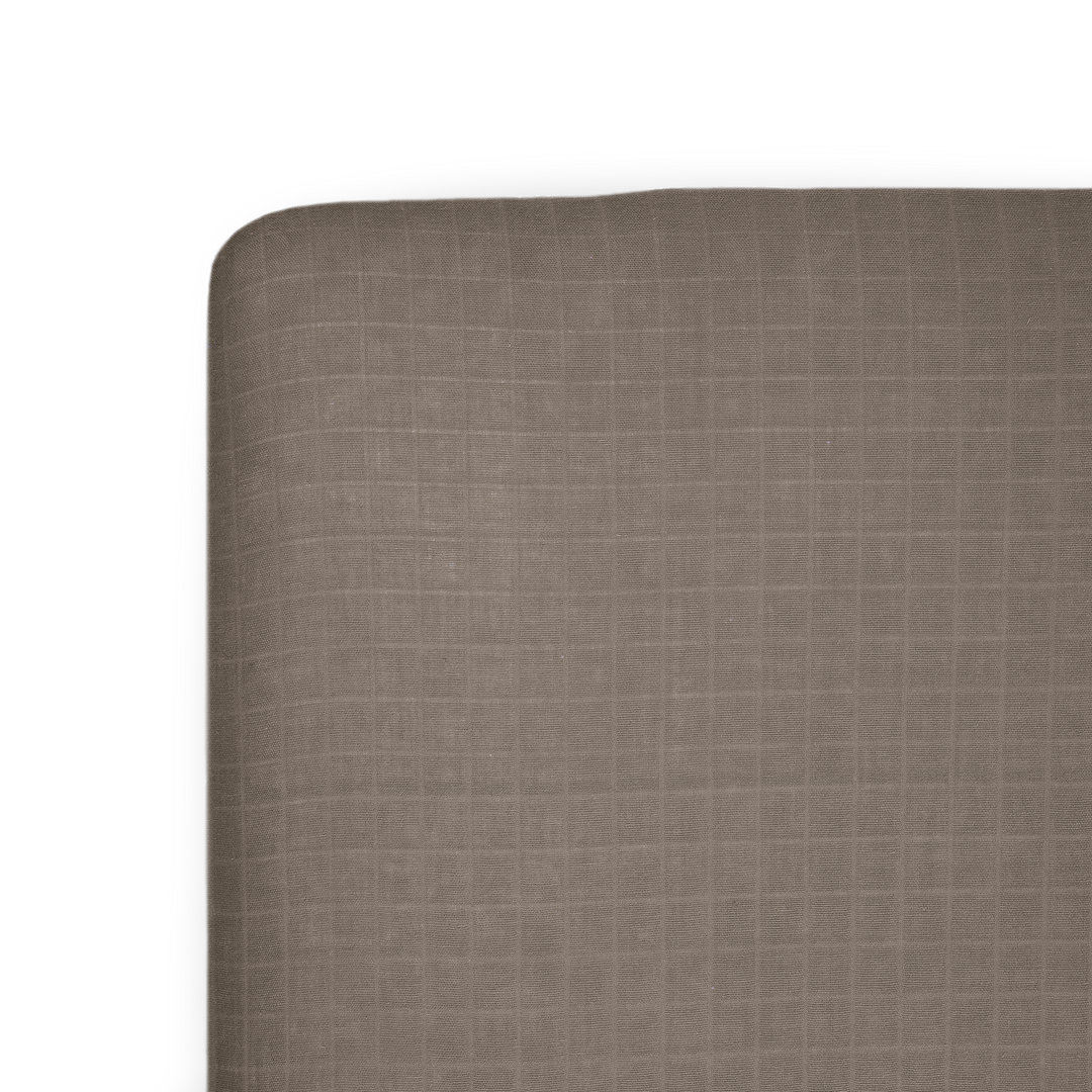 Little Unicorn Cotton Muslin Crib Sheet - Mocha on crib mattress, soft and breathable baby crib sheets for everyday comfort