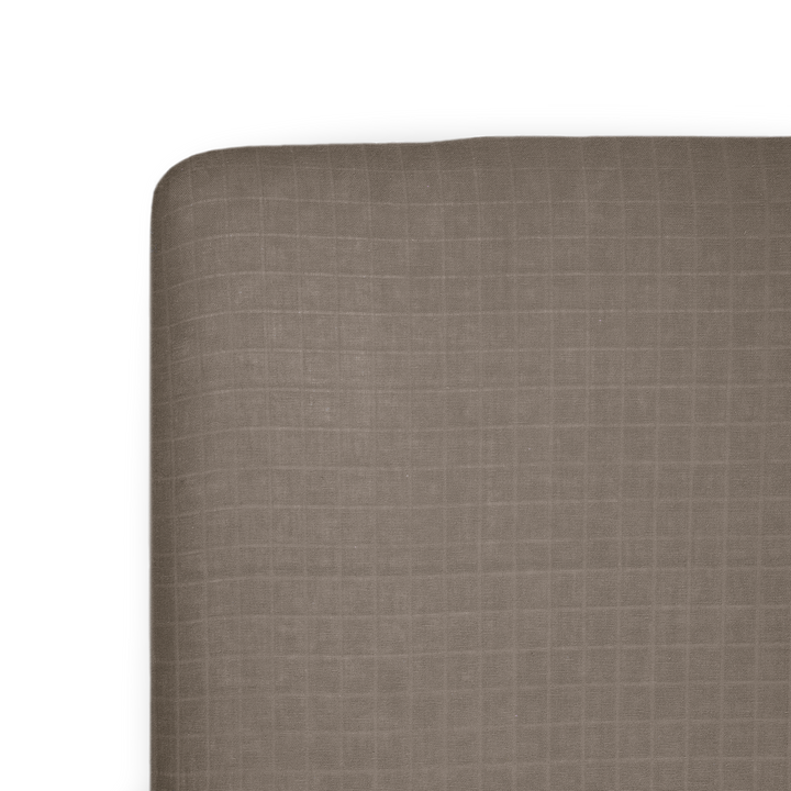 Little Unicorn Cotton Muslin Crib Sheet - Mocha on crib mattress, soft and breathable baby crib sheets for everyday comfort