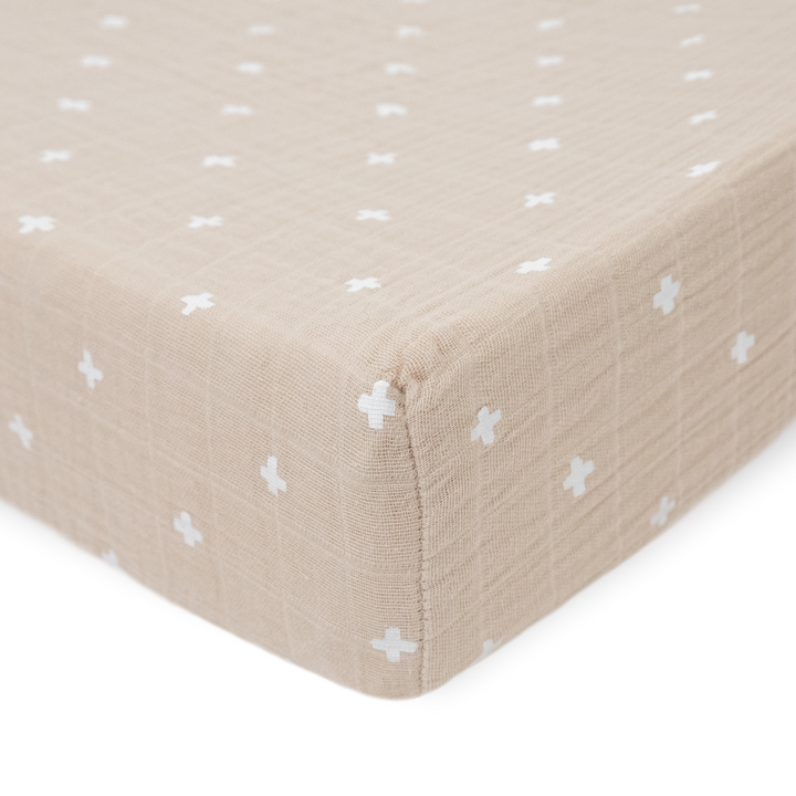 Protect your baby’s surface with Little Unicorn Taupe Cross changing pad