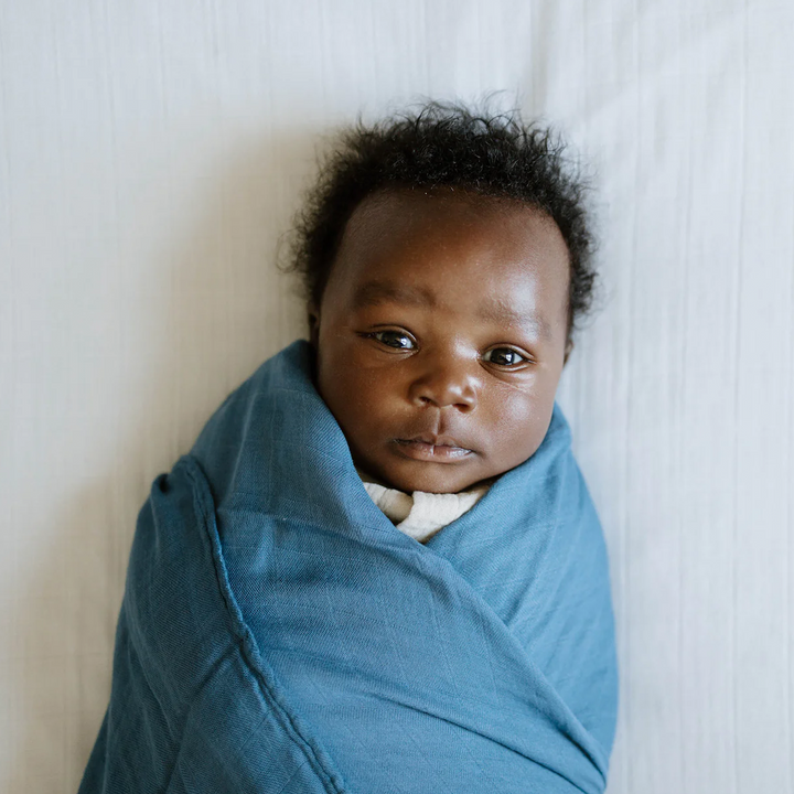 Little Unicorn Organic Cotton Muslin Crib Sheet - White displayed on crib, gentle mattress sheets for crib, perfect for babies