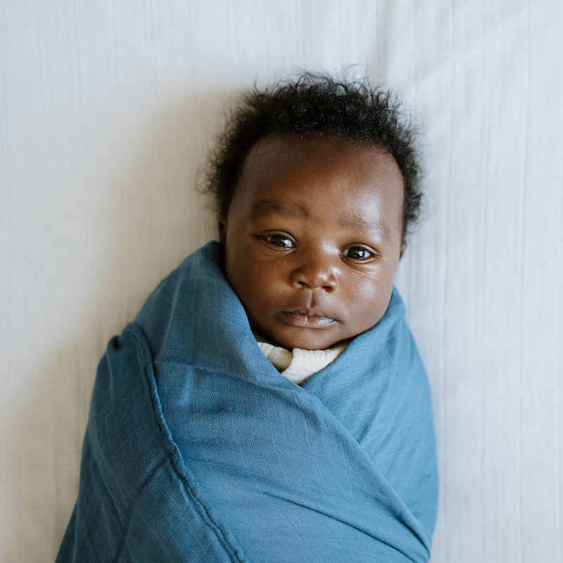 Little Unicorn Organic Cotton Muslin Crib Sheet - White displayed on crib, gentle mattress sheets for crib, perfect for babies