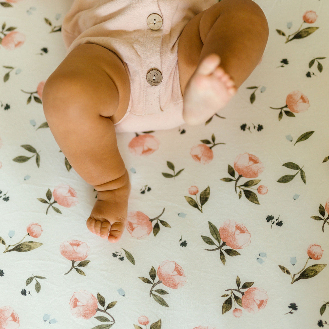 Little Unicorn Stretch Knit Crib Sheet - Watercolor Rose displayed in a nursery setting, perfect mattress sheets for crib comfort.