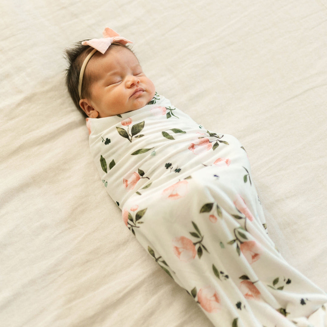 Soft muslin for swaddling by Little Unicorn, Stretch Knit Swaddle Blanket in Watercolor Rose.