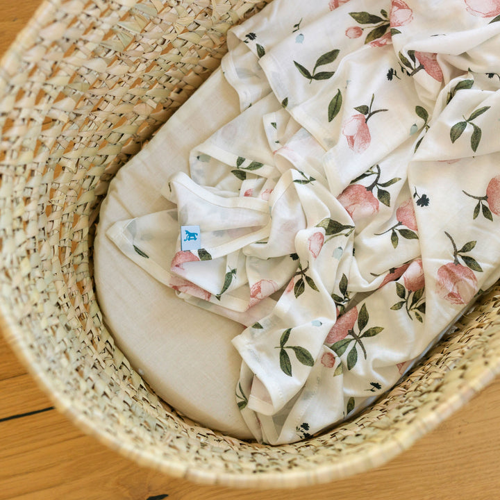 Snuggle your baby with Little Unicorn Watercolor Rose Stretch Knit Swaddle Blanket, soft muslin swaddle.