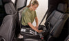 woman installing wayfinder travel system carseat base in car by BOB gear