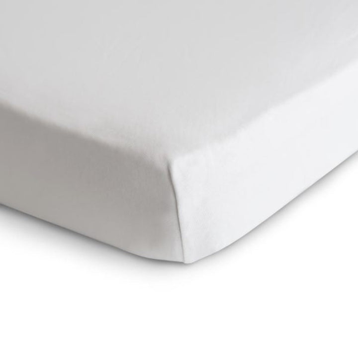 Mushie stretchy crib sheet in white designed for a comfortable baby sleep