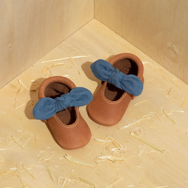Freshly Picked Corduroy Cowgirl Knotted Bow baby shoes pair on surface, gift-ready