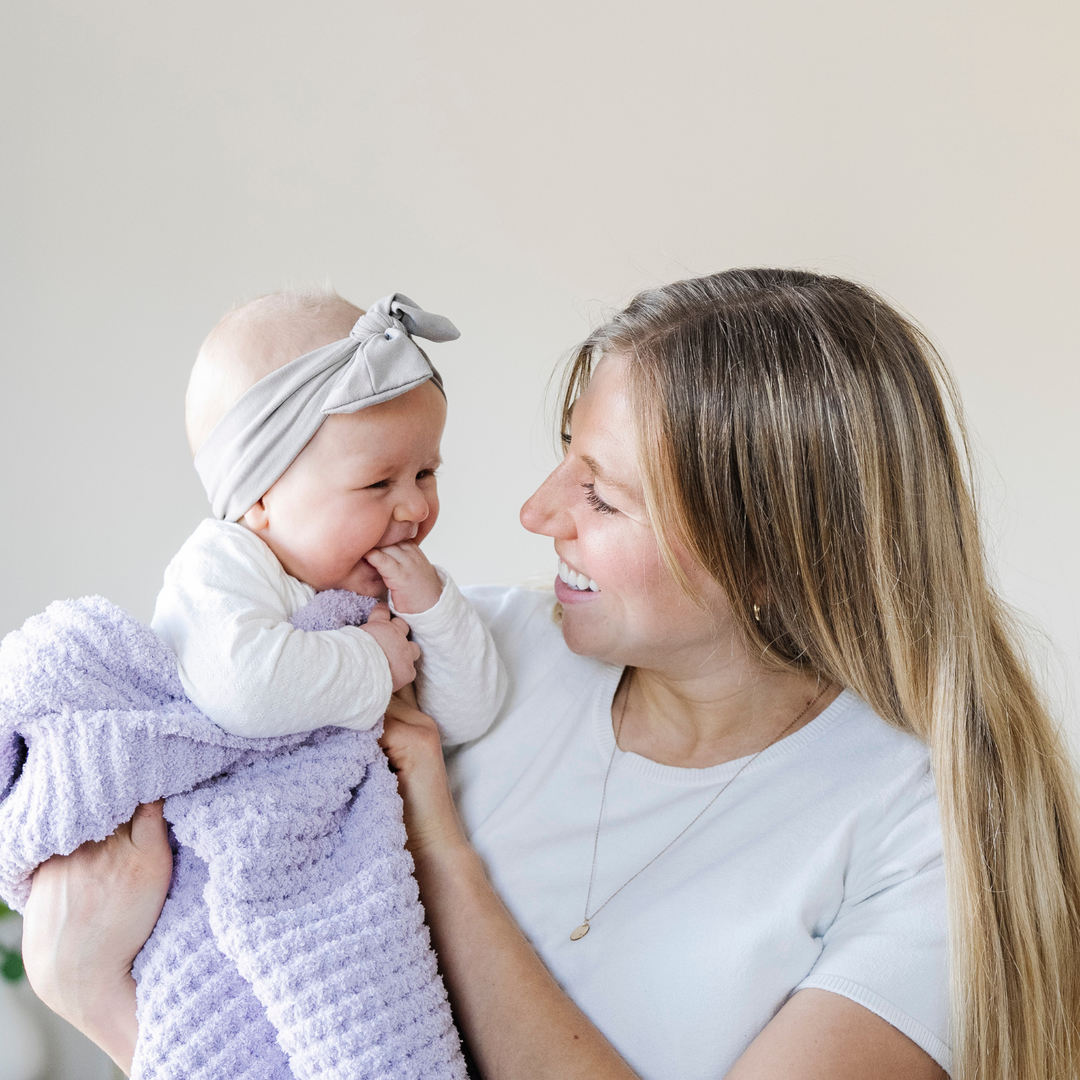 The Wisteria Saranoni Waffle Knit Mini Blanket adds gentle loft and an ultra cozy feel great for a Baby blanket staple.