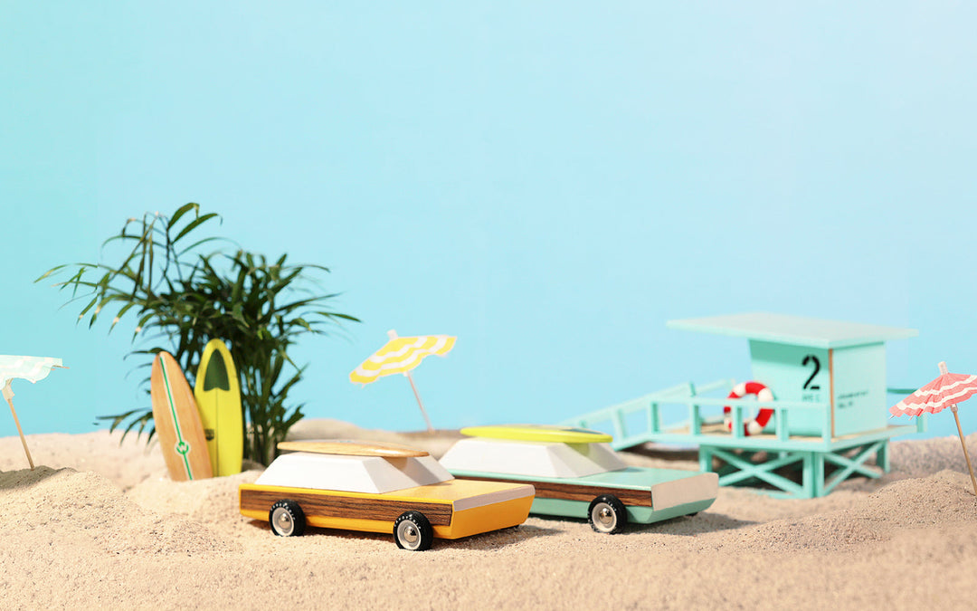 Malibu color Plantoys Woodie Redux wooden toy car, a race car toy for imaginative play.