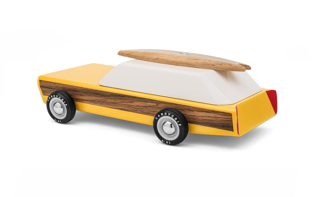 A rear perspective highlights the Plantoys Woodie, offering a simple and sturdy toy car for everyday play.