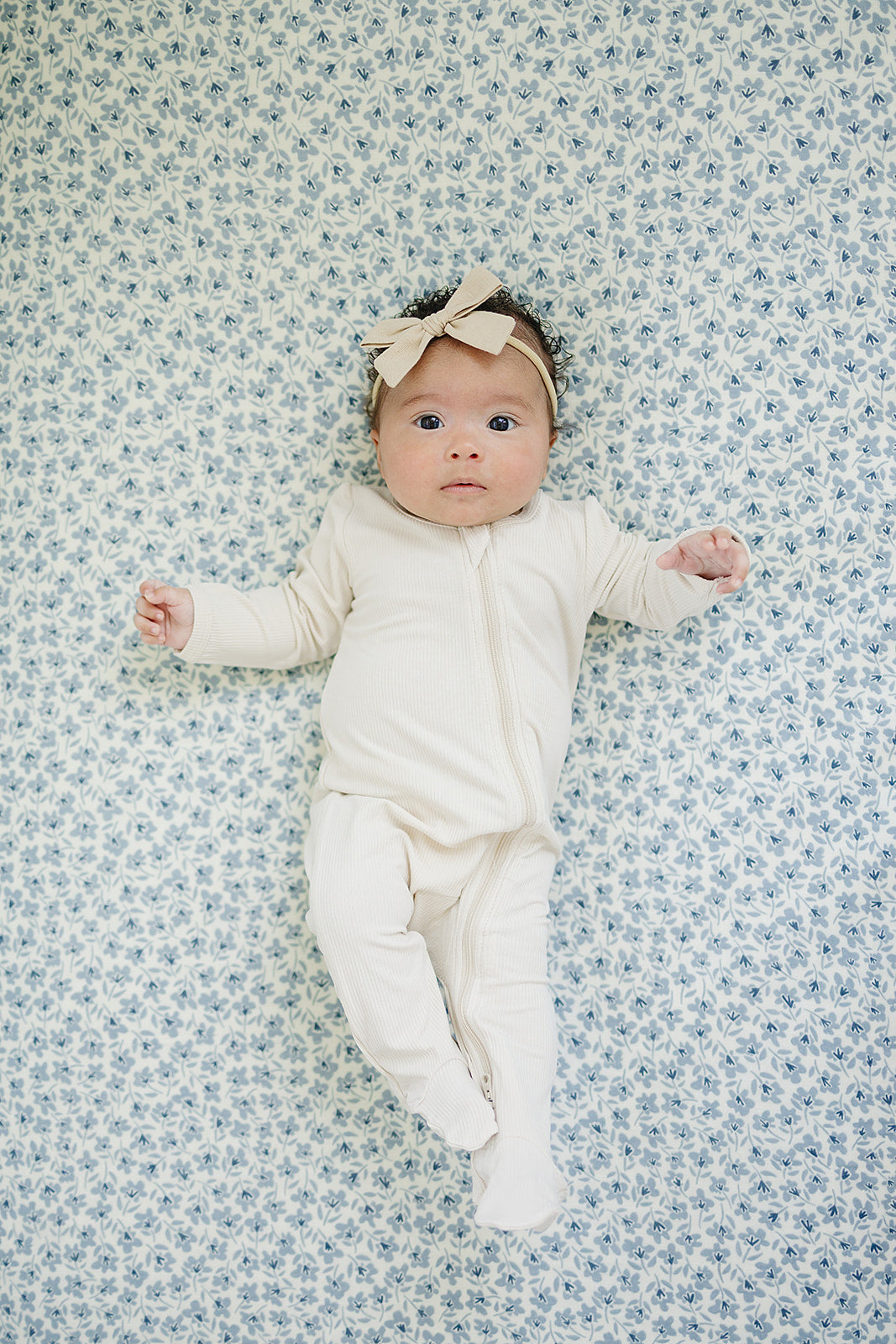 The Mebie Baby Blue Blossom Muslin Crib Sheet offers a snug and gentle fit, perfect fitted crib sheets for infants.