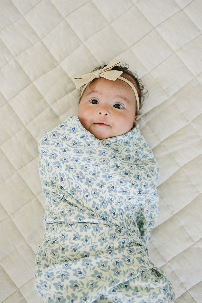 Keep babies cozy with the Mebie Baby Blue Blossom Muslin Swaddle Blanket, an ideal swaddling muslin blanket.