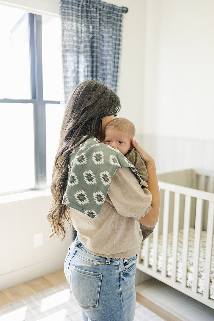 The Southwest Aztec Muslin Burp Cloth by Mebie Baby makes stylish and practical bibs for babies.