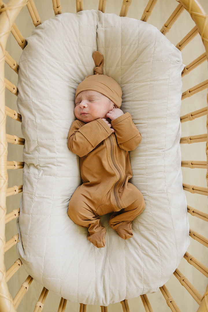 Mebie Baby Mustard Bamboo Footed Zipper photographed in natural light to show true color