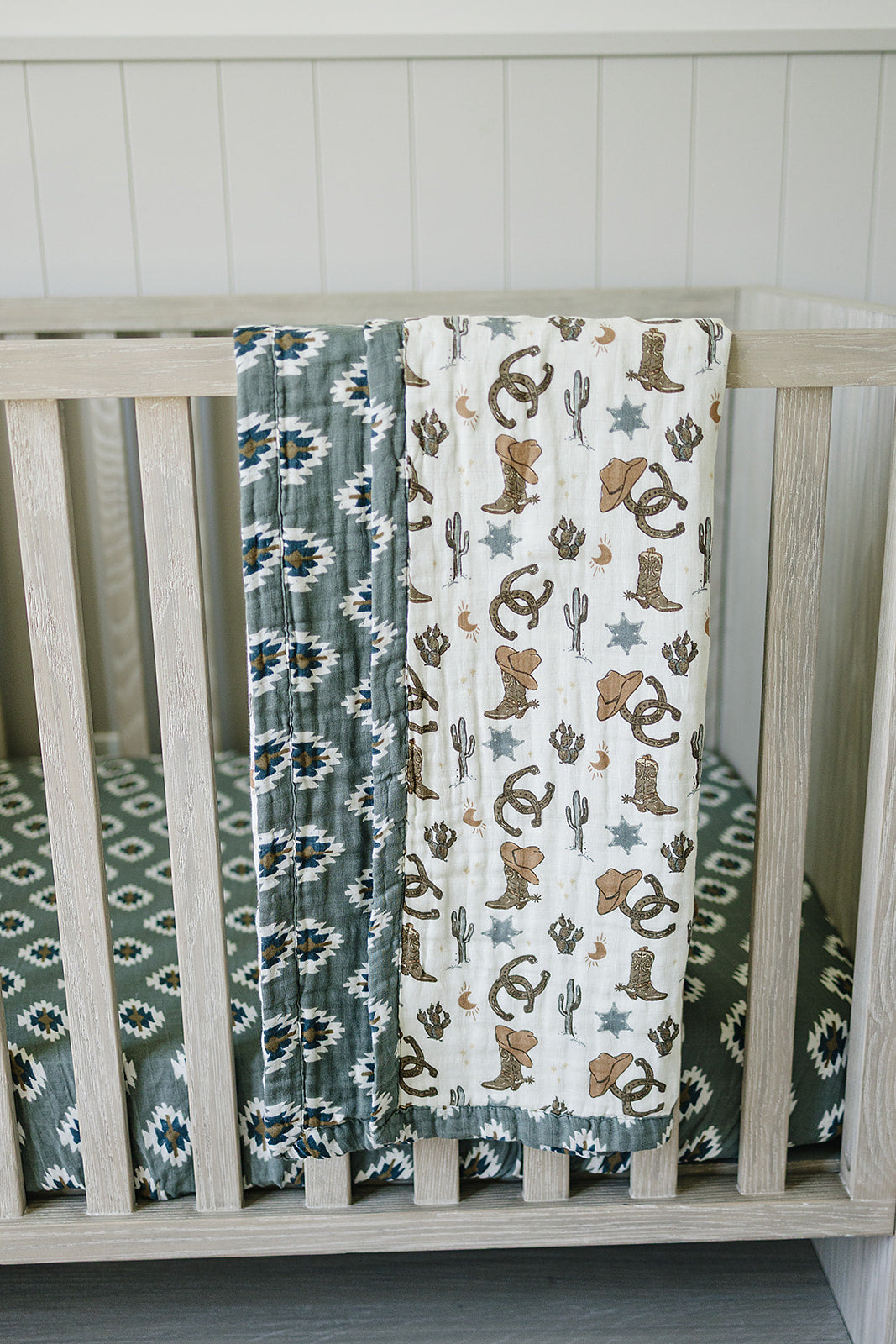 The Mebie Baby Southwest Aztec Muslin Crib Sheet provides a snug, breathable fit as premium crib bed sheets.