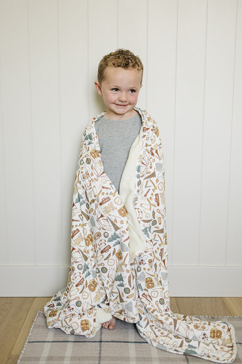 Soft and plush, the Mebie Baby Camping Trip Bamboo Fleece Quilt works as one of the best baby blankets.