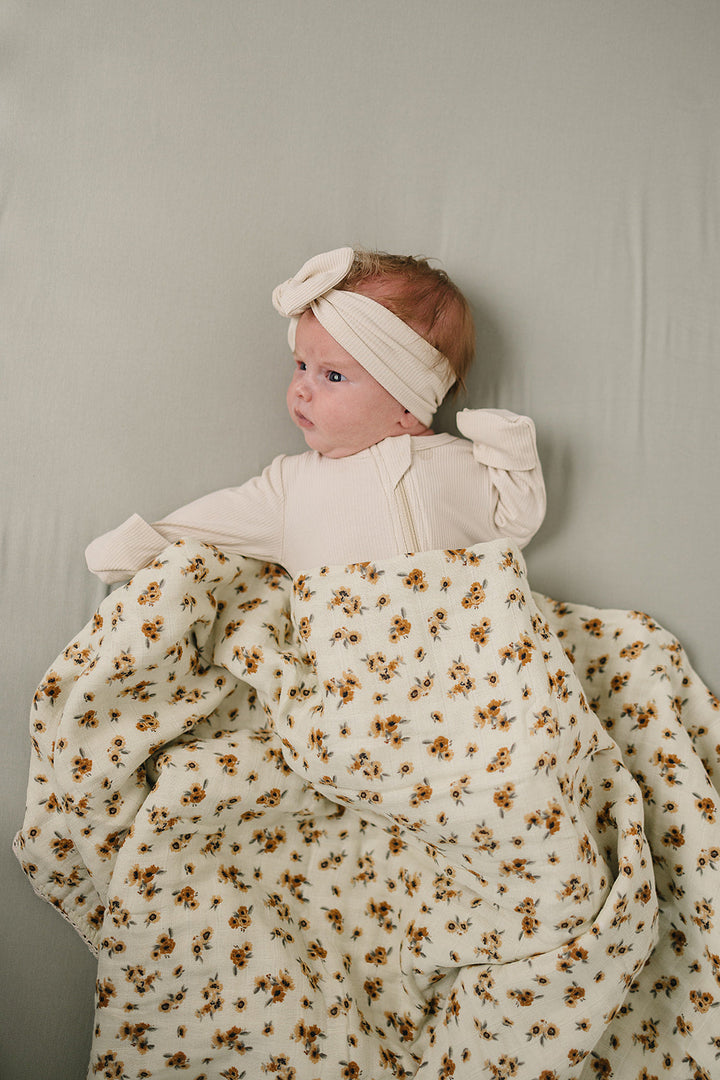 Keep infants cozy with the Mebie Baby Venetian Floral + Autumn Bloom Lace Muslin Quilt, ideal muslin blankets.