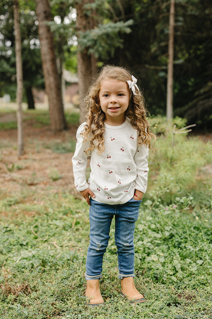 Soft and charming, the Mebie Baby Cherry Pointelle Long Sleeve Tee is ideal for cute baby clothes collections
