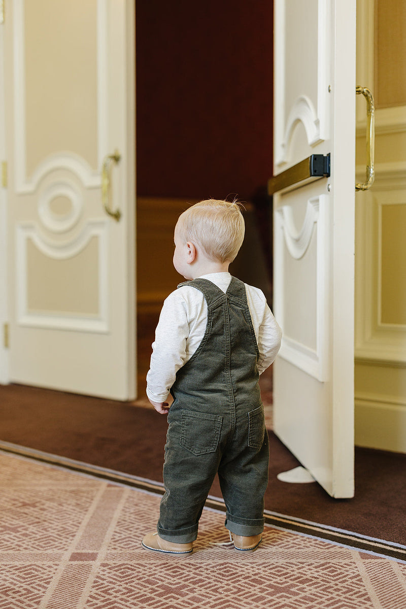 Mebie Baby Green Corduroy Overalls photographed for everyday wear, a staple choice for best baby clothes wardrobes
